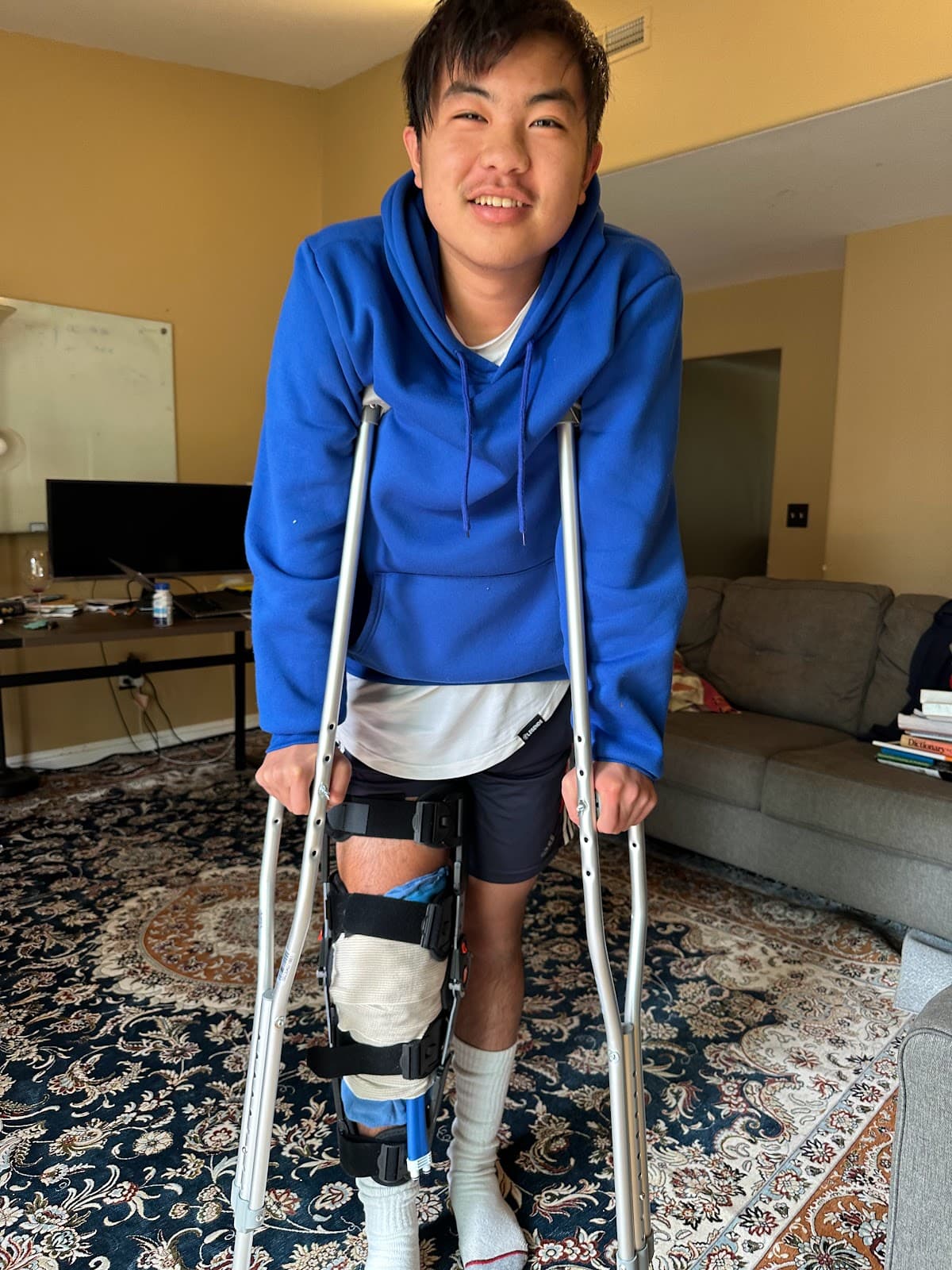 Smiling on Crutches at Home